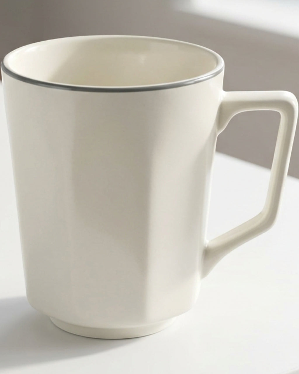 Zexan Faceted Porcelain Coffee Mug 330 ml Ivory and Graphite - Lifestyle view