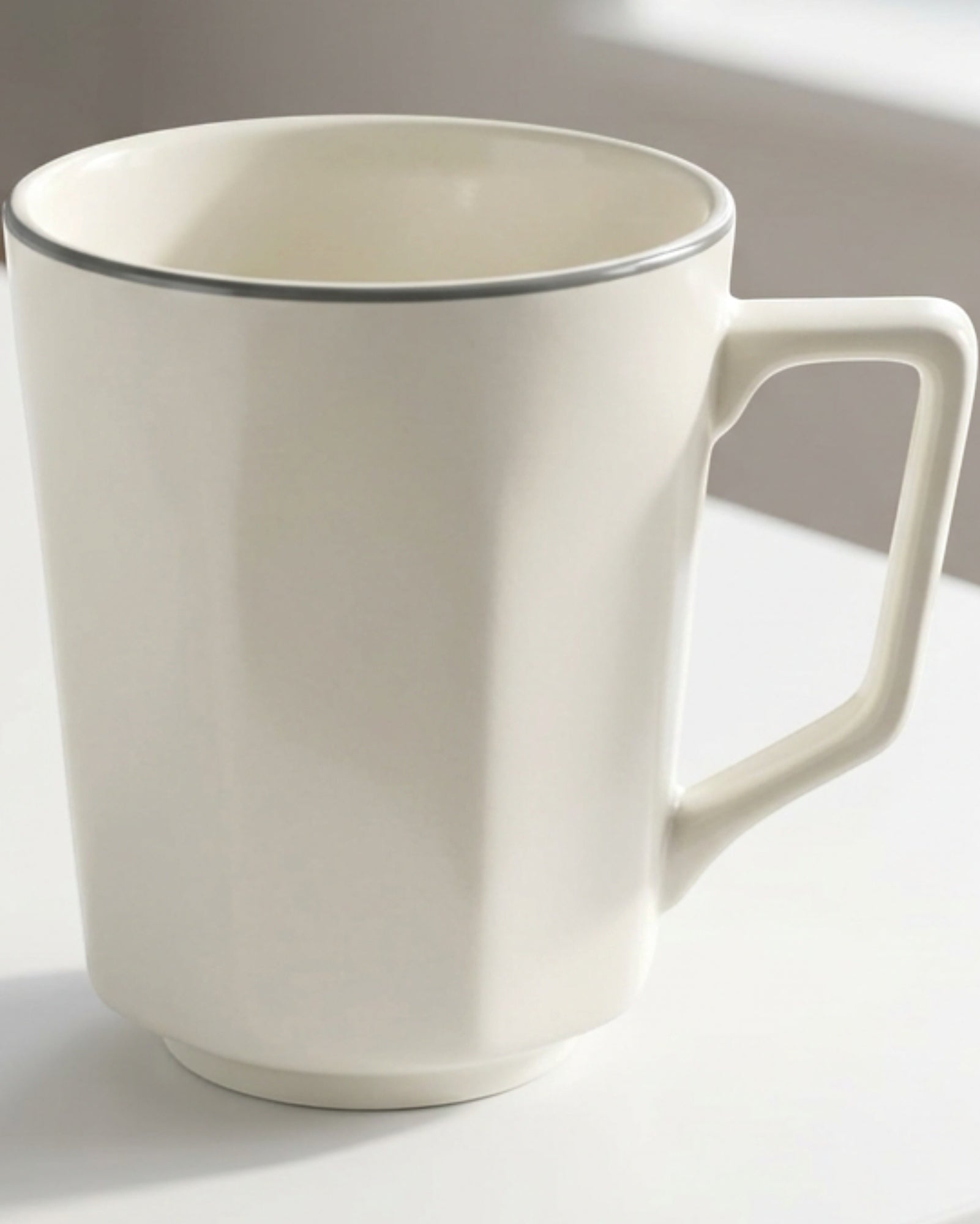 Zexan Faceted Porcelain Coffee Mug 330 ml Ivory and Graphite - Lifestyle view